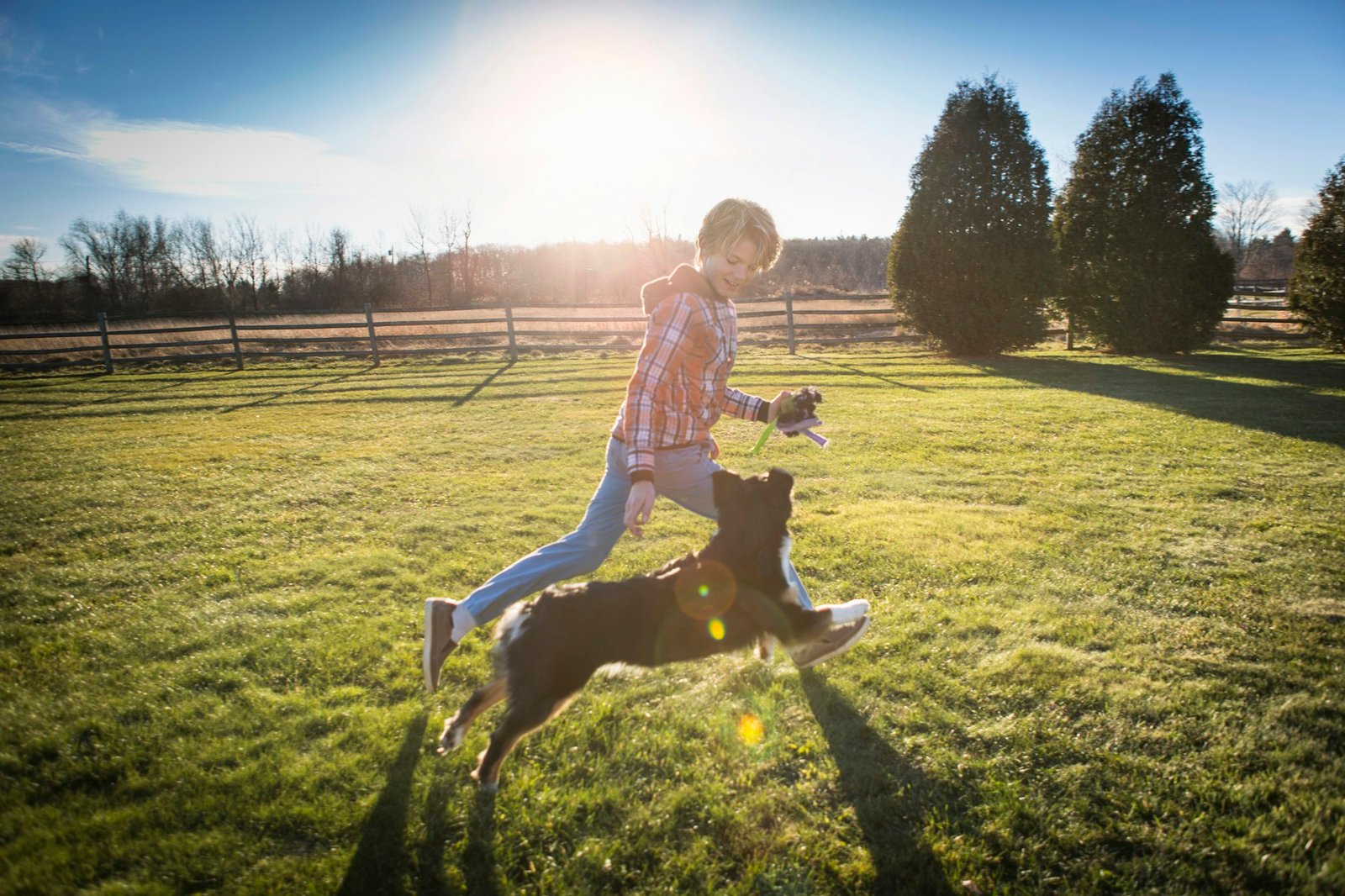 Boy running with dog